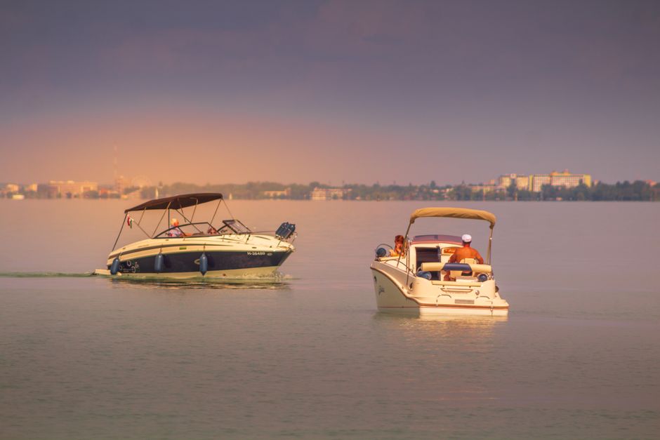 Boats with bimini tops on lake